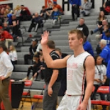 Boy's basketball player waving