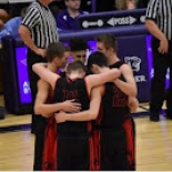 Boy's basketball players huddle