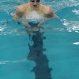 Student doing breast stroke