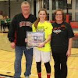 Girl's basketball player holding award