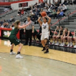 Girl's basketball player shooting ball