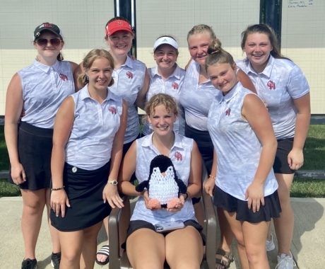 girls golf group with penguin