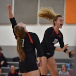 Girls Volleyball players jumping